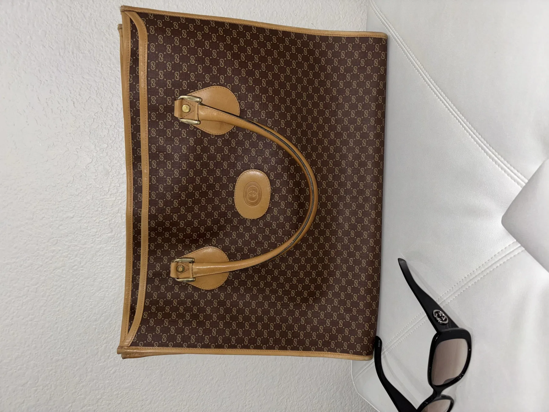 Vintage monogram handbag styled with black sunglasses
